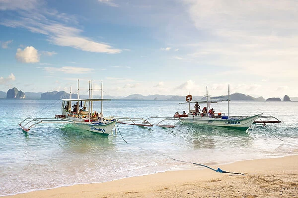 Outrigger boats anchored at Dilumacad Island (Helicopter Island), El Nido, Palawan