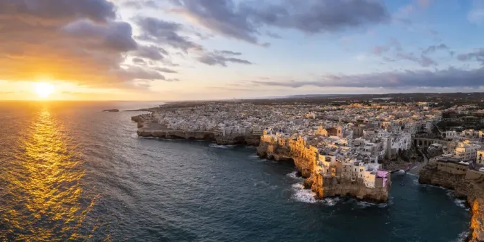 Framed Print : Overhanging houses of Polignano a Mare at sunrise. Bari district, Apulia, Italy Framed Print : Overhanging houses of Polignano a Mare at sunrise. Bari district, Apulia, Italy