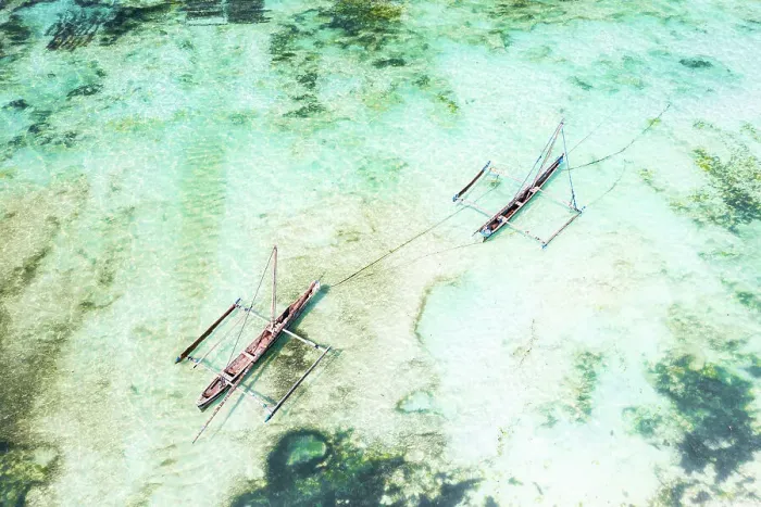 Framed Print : Overhead view of dhow boats moored in the emerald green water of lagoon, Paje, Jambiani, Zanzibar, Tanzania
