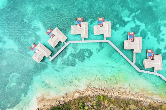 Framed Print : Overhead view of luxury tourist resort with overwater bungalows in the crystal water of Caribbean Sea, Antigua, West Indies Framed Print : Overhead view of luxury tourist resort with overwater bungalows in the crystal water of Caribbean Sea, Antigua, West Indies