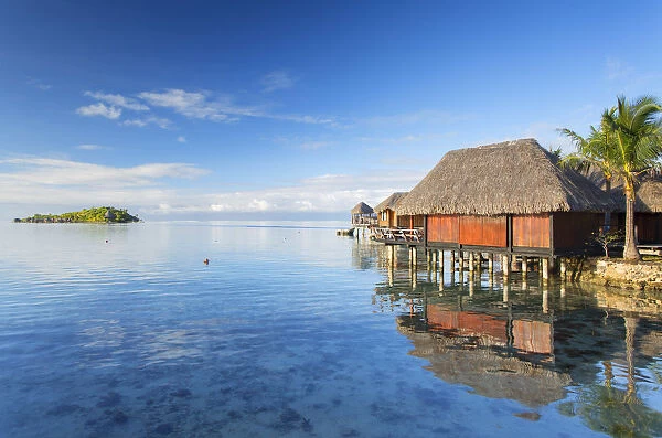 Overwater bungalows of Sofitel Hotel with Sofitel Private Island in background, Bora Bora