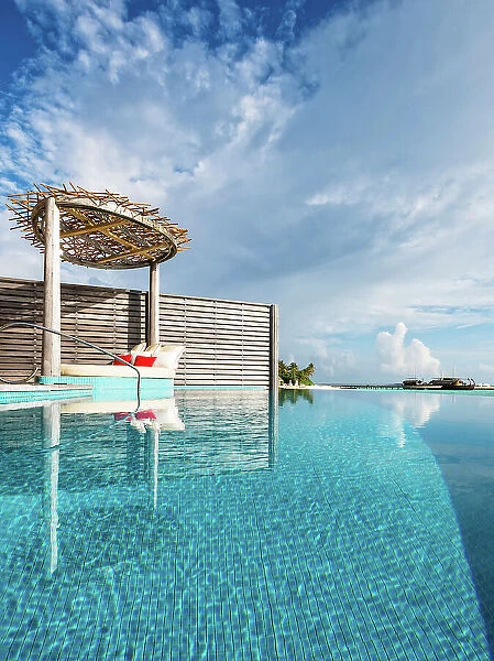 Overwater villa infinity pool reflections, Baa Atoll, Maldives