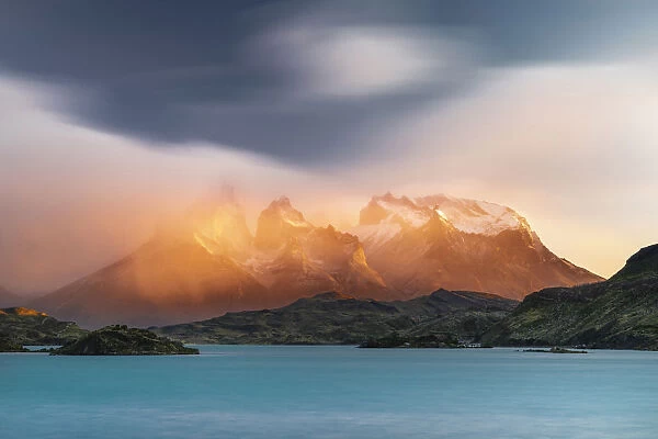 Paine Horns, Cerro Paine and Lake Pehoa at sunrise. Torres del Paine National Park