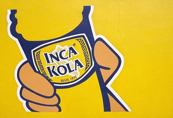 A painted sign for Inca Kola