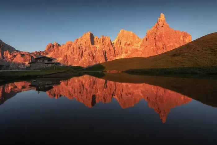 Framed Print : The Pale di San Martino lit up at sunset during a summer evening, reflecting in the pond of the Baita Segantini. Dolomites, Italy