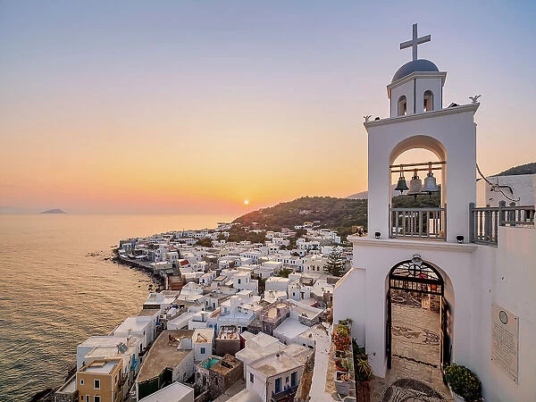 Panagia Spiliani, Blessed Virgin Mary of the Cave Monastery, Bell Tower and Mandraki Town at sunrise, Nisyros Island, Dodecanese, Greece