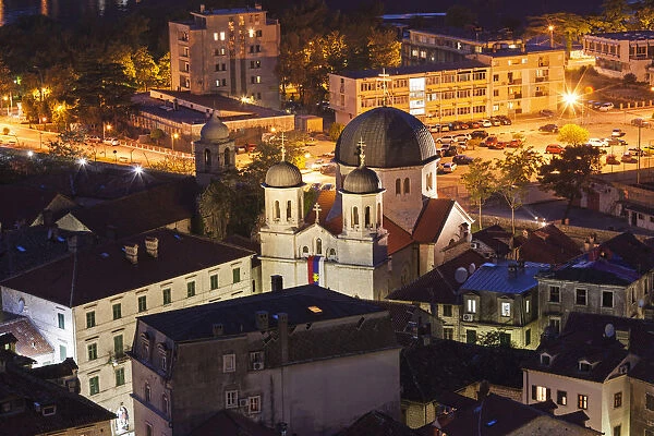Panorama of Kotor at night with a detail on the Orthodox Church of St
