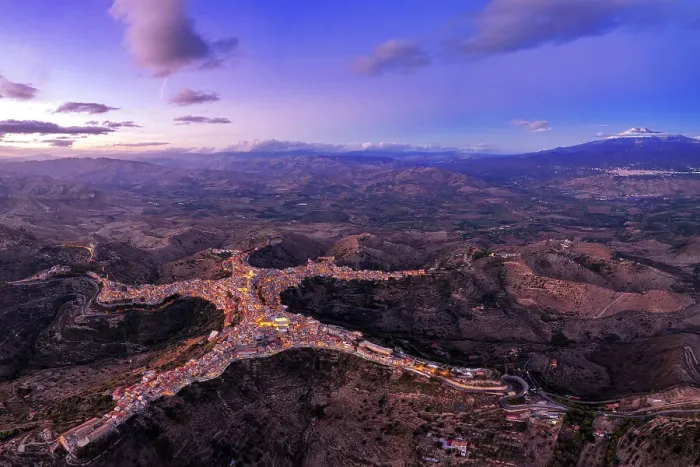 Framed Print : Panoramic aerial view of the man-shaped (or star-shaped) illuminated village of Centuripe with Etna volcano, Centuripe, Enna province, Sicily, Italy Framed Print : Panoramic aerial view of the man-shaped (or star-shaped) illuminated village of Centuripe with Etna volcano, Centuripe, Enna province, Sicily, Italy