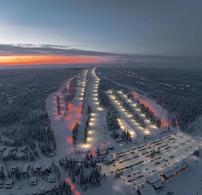 Framed Print : Panoramic aerial view of people skiing on the snowy ski slopes of Iso Syote winter resort at dusk, Pudasjarvi, Lapland, Finland