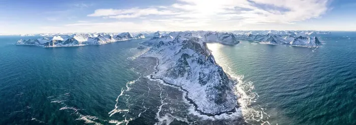 Framed Print : Panoramic aerial view of waves crashing on snowy mountains, Mefjorden, Senja, Troms county, Norway Framed Print : Panoramic aerial view of waves crashing on snowy mountains, Mefjorden, Senja, Troms county, Norway