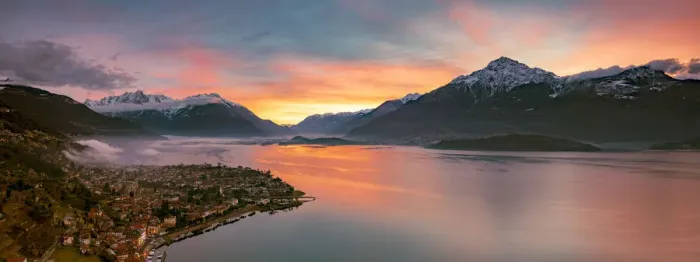 Framed Print : Panoramic of Lake Como and the lakeshore town of Domaso at sunrise, aerial view