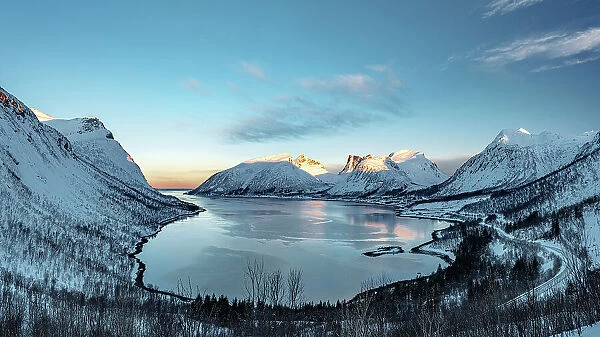 Panoramic of snowy frozen mountains and sea from Bergsbotn viewpoint, Bergsfjord, Senja, Troms county, Norway