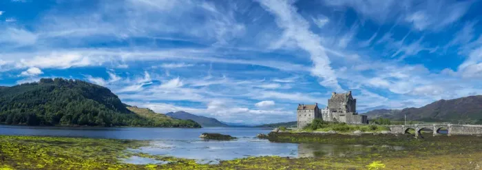 Framed Print : Panoramic view of Eilean Donan Castle by Loch Duich against blue sky, Dornie, Kyle Framed Print : Panoramic view of Eilean Donan Castle by Loch Duich against blue sky, Dornie, Kyle