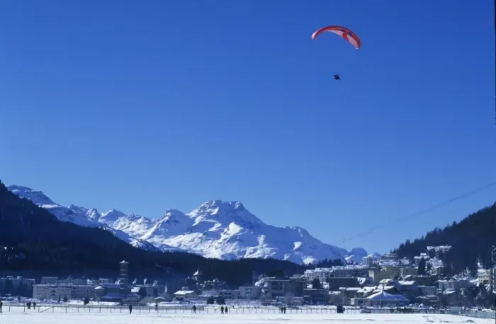 Framed Print : A paraglider comes into land on the frozen Framed Print : A paraglider comes into land on the frozen