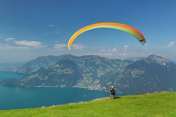 Paraglider on Niederbauen Mountain, Lake Lucerne, Canton Uri, Switzerland