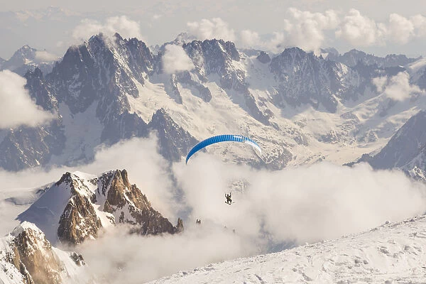 Paragliding from the summit of Mount Balnc after rising it by ski mountaneering