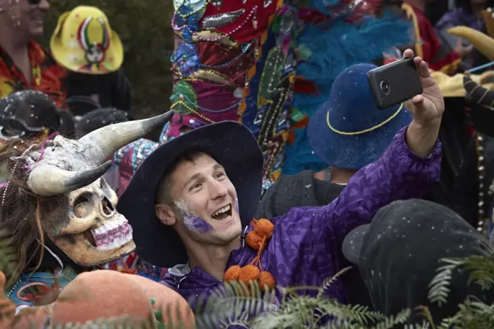 Framed Print : A participant of the Carnival in Uquia takes a selfie with a devil, Jujuy, Argentina. Hundreds of devils descend from the Cerro Blanco hill to celebrate the start of Carnival Framed Print : A participant of the Carnival in Uquia takes a selfie with a devil, Jujuy, Argentina. Hundreds of devils descend from the Cerro Blanco hill to celebrate the start of Carnival