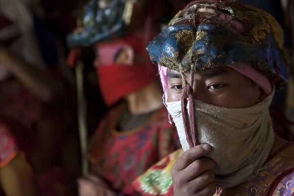 Participants and spectators prepare for the Tsechu at Thangbi Mani monastery in Bhutan
