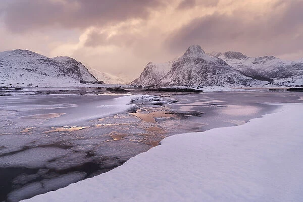 Partly frozen fjord during winter in the Lofoten islands, Norway