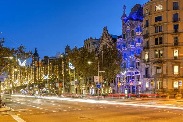 Passeig de Gracia avenue adorned with Christmas lights and Casa Battlo, Barcelona