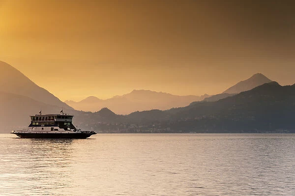 Passenger ferry on Lake Como at sunset, Varenna, Lombardy, Italy