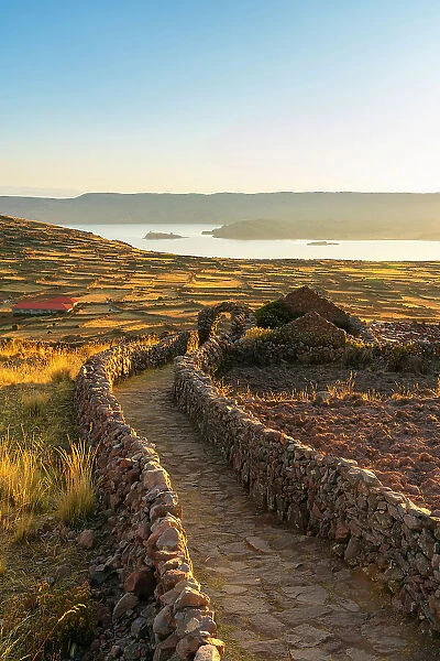 Path leading to Pachatata ceremonial center at sunset, Amantani Island, Lake Titicaca, Puno Province, Puno Region, Peru