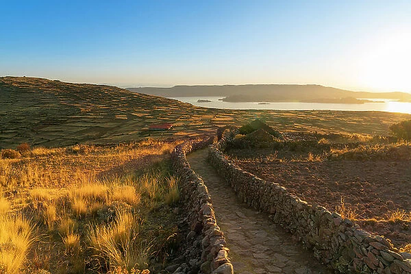 Path leading to Pachatata ceremonial center at sunset, Amantani Island, Lake Titicaca, Puno Province, Puno Region, Peru