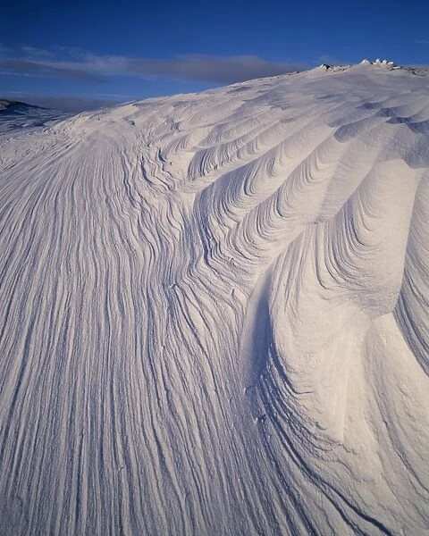 Patterns etched into the snow by the wind on Ben Chaorach
