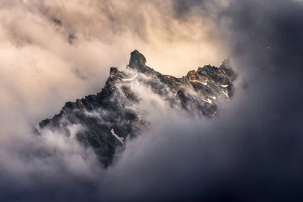 Peaks of the Alps appearing during a storm clearing, Alps, France