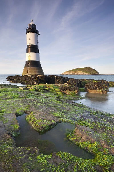 Penmon Point lighthouse and Puffin Island on the east coast of Anglesey, North Wales, UK