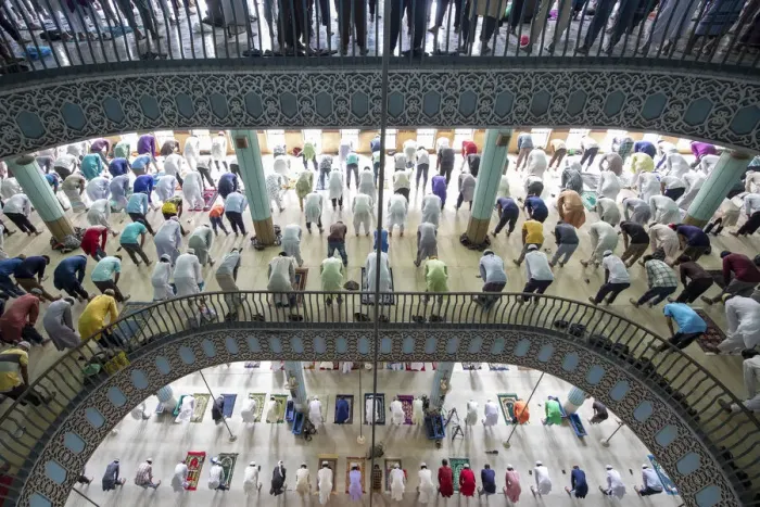 Framed Print : People come together to pray over several floors of one of the biggest mosques in Framed Print : People come together to pray over several floors of one of the biggest mosques in
