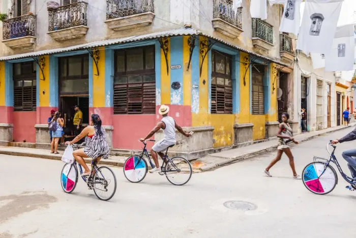 Framed Print : People cycling in a street in La Habana Vieja (Old Town), Havana, Cuba