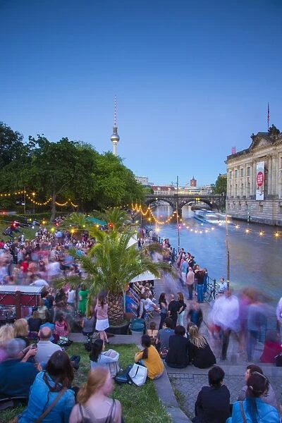 People dancing by the Spree River, Berlin, Germany