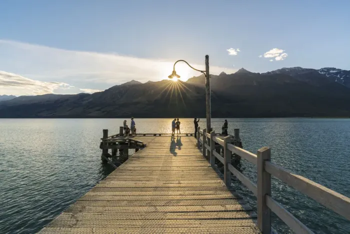 Framed Print : People on the jetty on Lake Wakatipu just before sunset Framed Print : People on the jetty on Lake Wakatipu just before sunset