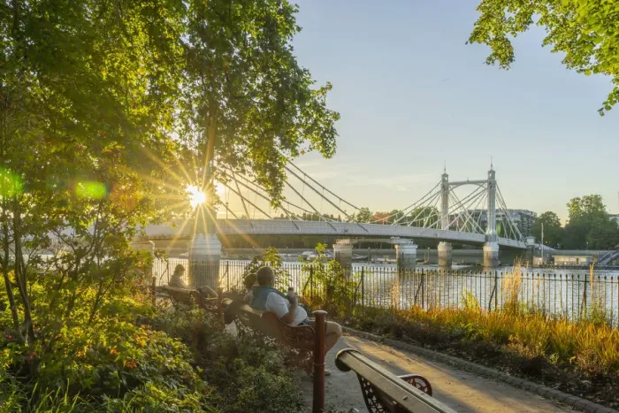 Framed Print : People relaxing by Albert Bridge at sunset, London, England, UK