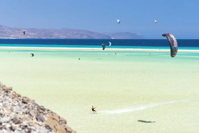 Framed Print : People riding the ocean waves with kiteboard at Sotavento beach, Jandia, Fuerteventura Framed Print : People riding the ocean waves with kiteboard at Sotavento beach, Jandia, Fuerteventura