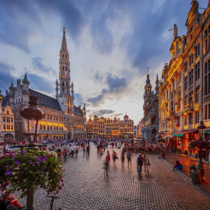 Framed Print : People walking in the Grand Place in Brussels with the Town Hall in the background Framed Print : People walking in the Grand Place in Brussels with the Town Hall in the background