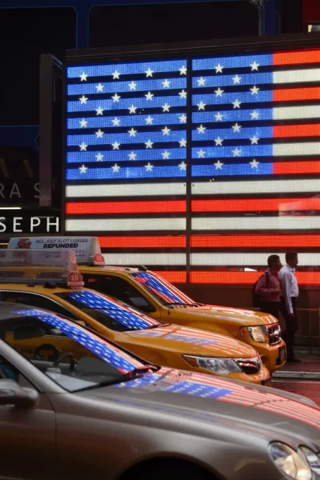 Framed Print : People walking past Neon sign of American Flag on Times Square, New York, Manhattan, USA Framed Print : People walking past Neon sign of American Flag on Times Square, New York, Manhattan, USA