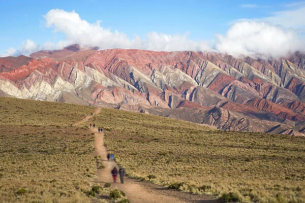 People walking along the path to the Hornocal (Mountain of 14 colours)