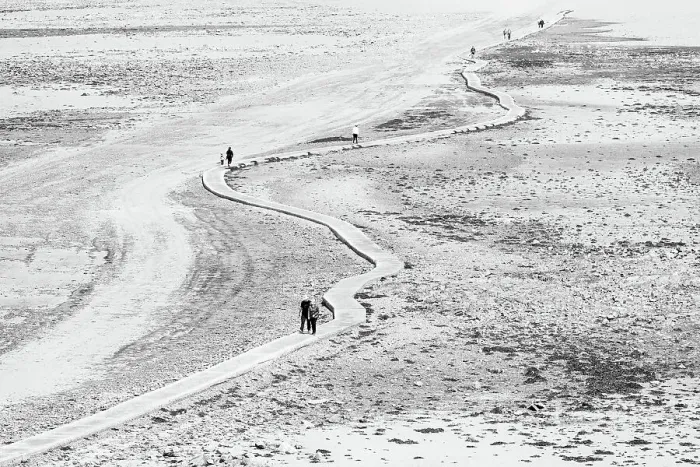 Framed Print : People walking along the winding causeway at low tide from the quay side to Elizabeth Castle, Jersey, Channel Islands Framed Print : People walking along the winding causeway at low tide from the quay side to Elizabeth Castle, Jersey, Channel Islands
