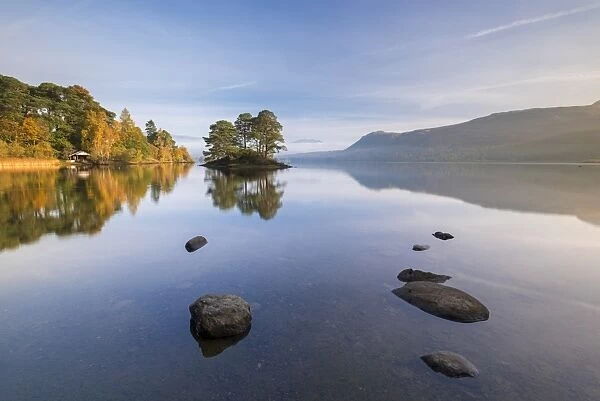 Perfect reflections on Derwent Water near Otter Island on a sunny autumnal morning