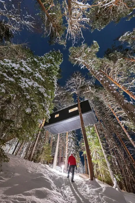 Framed Print : Person admiring the cabin room shaped like a capsule among tall trees in the snowy forest, Tree Hotel, Harads, Lapland, Sweden Framed Print : Person admiring the cabin room shaped like a capsule among tall trees in the snowy forest, Tree Hotel, Harads, Lapland, Sweden