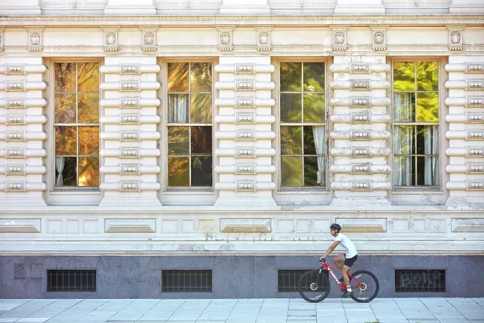 Framed Print : A person riding a bike in front of the main facade of Palacio Sarmiento, Recoleta, Buenos Aires, Argentina. An eclectic style building declared national historic monument Framed Print : A person riding a bike in front of the main facade of Palacio Sarmiento, Recoleta, Buenos Aires, Argentina. An eclectic style building declared national historic monument