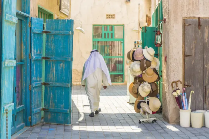 Framed Print : Person walking in Al Seef, Dubai Creek, Dubai, United Arab Emirates Framed Print : Person walking in Al Seef, Dubai Creek, Dubai, United Arab Emirates
