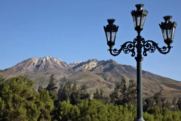 Framed Print : Peru, The extinct volcano, Chachani dominates the Arequipa skyline. Many buildings are built with sillar, stone mined from Framed Print : Peru, The extinct volcano, Chachani dominates the Arequipa skyline. Many buildings are built with sillar, stone mined from