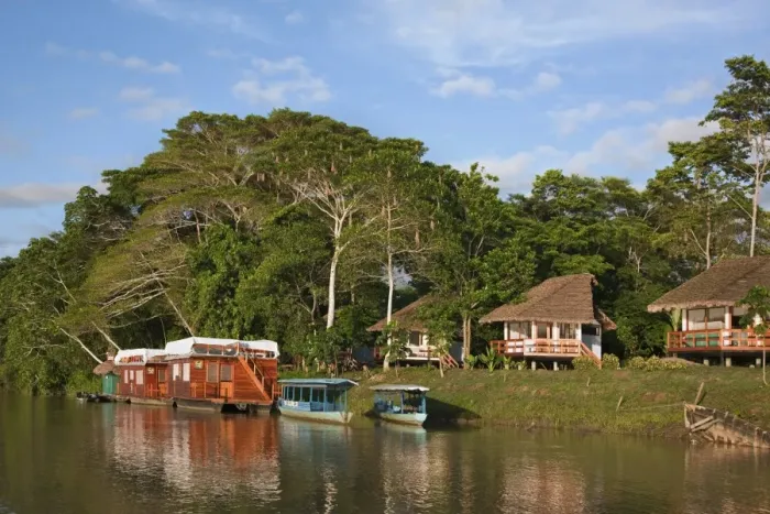 Framed Print : Peru. A tourist Lodge and two houseboats on the banks of the Madre de Dios River Framed Print : Peru. A tourist Lodge and two houseboats on the banks of the Madre de Dios River