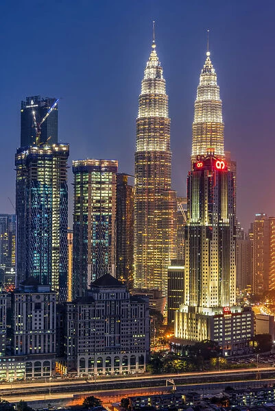 Petronas Twin Towers and city skyline at dusk, Kuala Lumpur, Malaysia