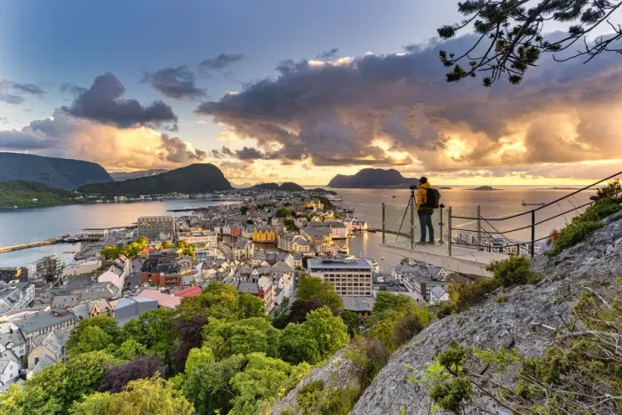 Framed Print : Photographer looking at Alesund during sunset from Byrampen viewpoint Framed Print : Photographer looking at Alesund during sunset from Byrampen viewpoint