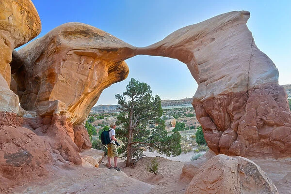 Photographer at Metate Arch, Devils Garden, Grand Staircase National Monument