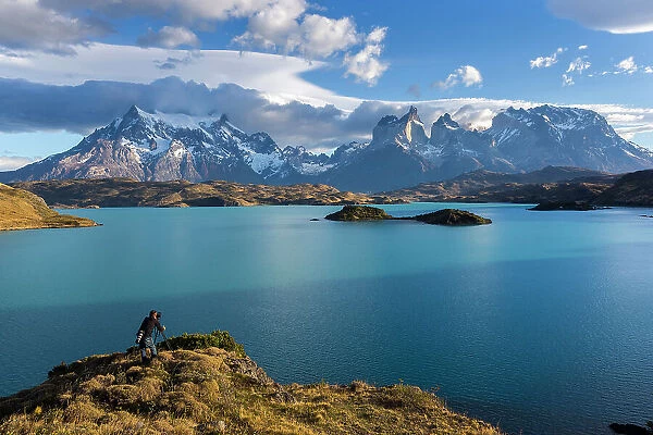 Photographer shooting Cuernos del Paine and Lake Pehoe, Torres del Paine National Park, Patagonia, Chile